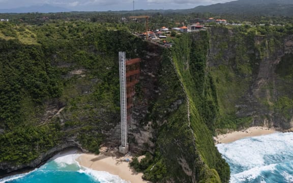 A drone shot captures the construction site at Kelingking Beach.