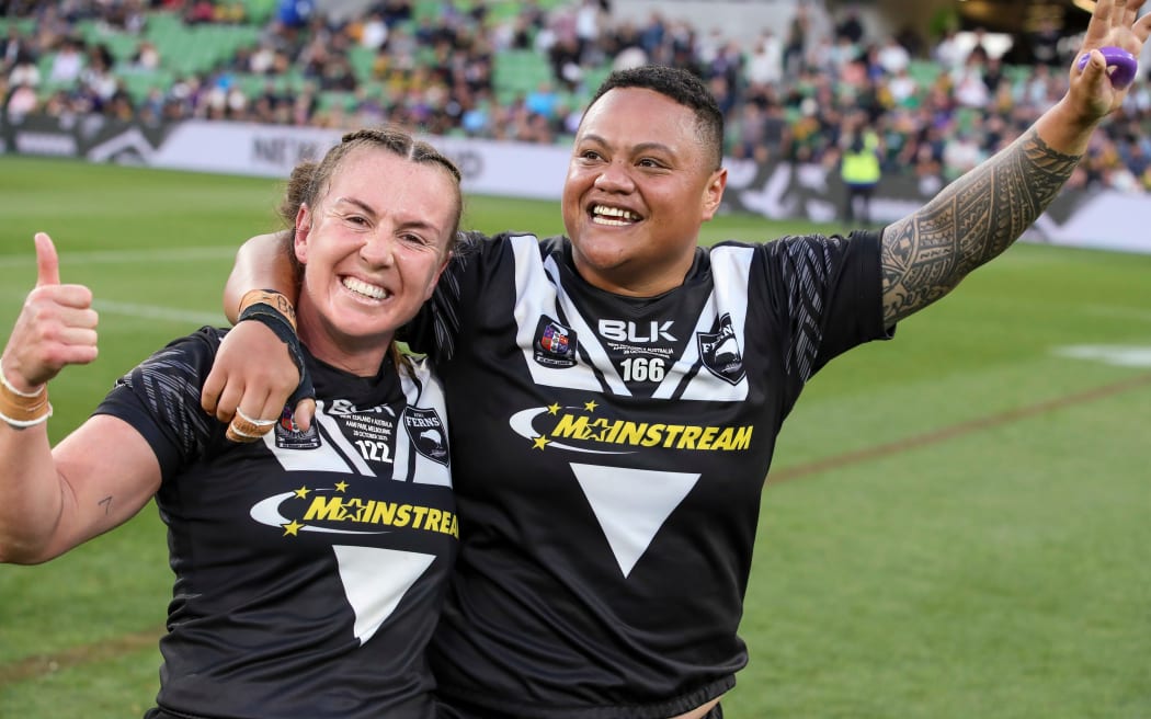 Kiwi Ferns players Georgia Hale (L) and Mele Hufanga celebrate after beating the Jillaroos.