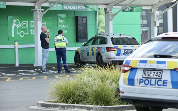 Police outside the Hobsonville Woolworths on Tuesday afternoon.