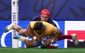 Uruguay's wing Nicolas Freitas scores a try against France. 2023 Rugby World Cup.