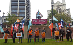 Protesters gather at the Octagon in Dunedin to urge Mondelez to retain the Cadbury factory.