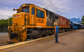 KiwiRail DXC 5520 Diesel Locomotive passenger train waiting at station in Kaikoura, New Zealand.