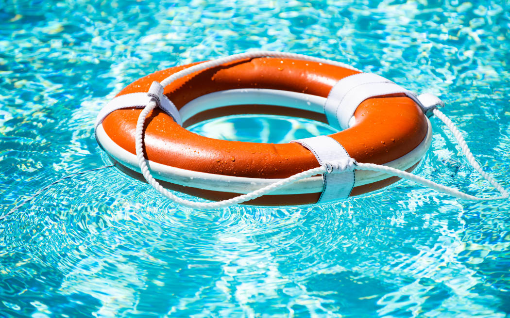 Drowning in water catch lifebuoy. Safety and urgent help. Resque needed. Life buoy floating in pool