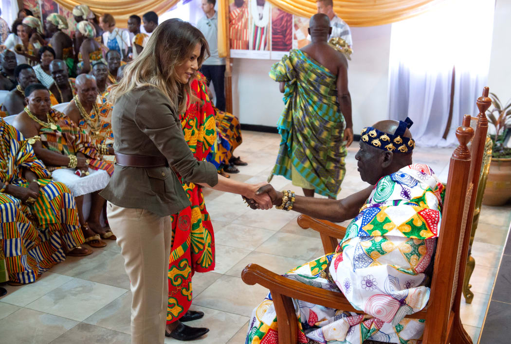 US First Lady Melania Trump shakes hands with Osabarimba Kwesi Atta II, the chieftan of the regional Fante tribe (R), at the Emintsimadze palace in Cape Coast, Ghana.