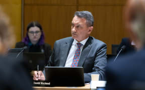 National Party MP David McLeod listening to evidence in select committee.