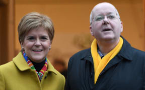 File photo. Scotland's then-First Minister and leader of the Scottish National Party (SNP) Nicola Sturgeon, with husband Peter Murrell, outside a polling station in Glasgow, Scotland, where she arrived to vote in Britain's general election, 12 December 2019.
