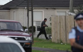 A cordon in Papatoetoe after a man was shot by police.