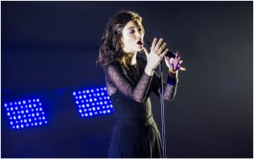 Lorde on stage at the Dunedin Town Hall