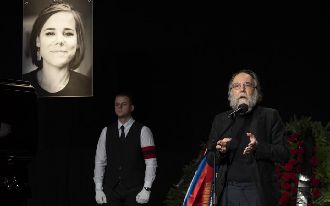 Russian philosopher Alexander Dugin (right) at the funeral of his daughter, Darya Dugina (pictured), who was killed in a car explosion on a road outside Moscow on 20 August 2022.