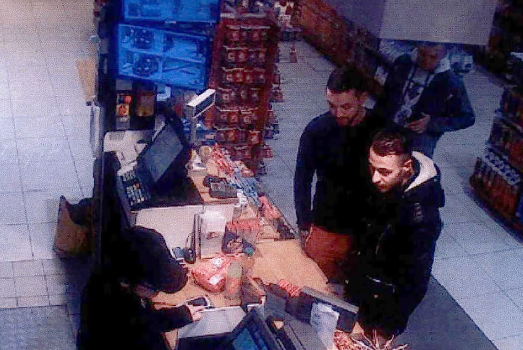 Salah Abdeslam, right, and Mohamed Abrini are captured on CCTV footage buying goods from a petrol station two days before the Paris attacks.