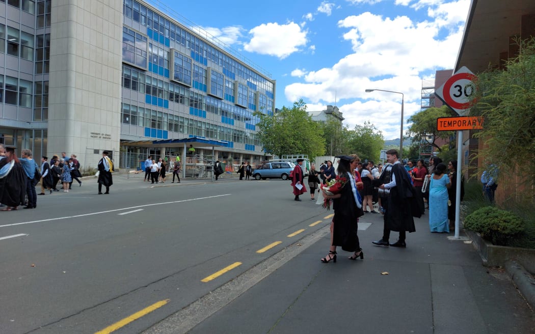 The procession dissipating after news the graduation ceremony was being postponed.