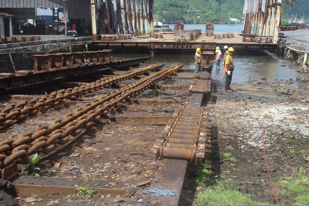 Shipyard workers conducting repairs to the 3,000 ton slipway in American Samoa