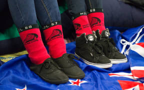 Red socks and fans at Shed 10, watch the America's Cup racing between Team New Zealand and Oracle in San Francisco, USA, Tuesday, September 24, 2013.