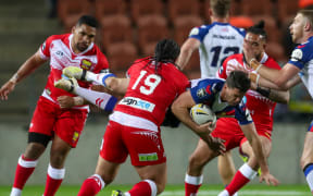 Konrad Hurrell tackles Lachlan Coote.