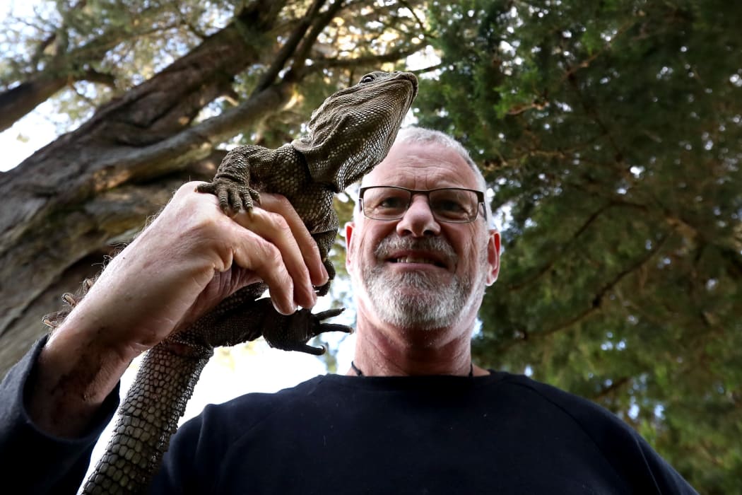 Lindsay Hazley with Henry the tuatara outside the Southland Museum and Art Gallery building