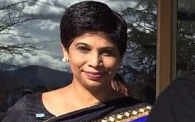 Fiji's Prime Minister Frank Bainimarama at the United Nations office in Geneva with Nazhat Shameem Khan in blue.