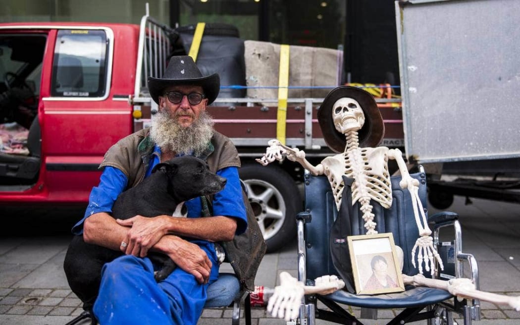 Dave Devenport was outside the New Plymouth Public Trust office on Thursday morning to protest the cost of death.