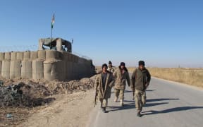 Afghan security forces patrol in the Marjah district of Helmand Province