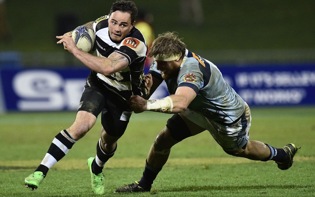Hawke's Bay's Zac Guildford is tackled by Shane Neville of Northland, 2015.