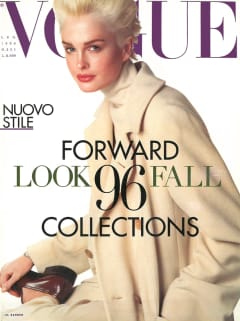 Kylie Bax - a young woman with short blonde hair - looks side on at the camera in a cream coat.