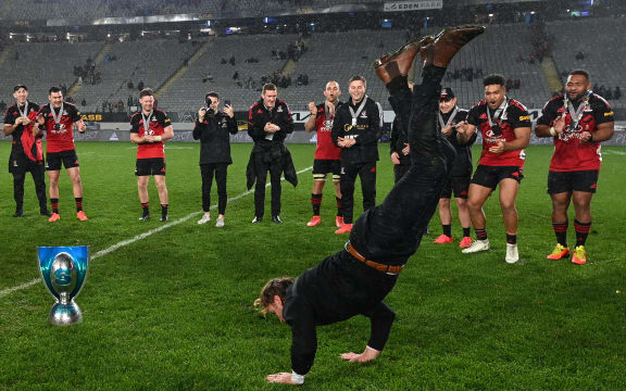 Crusaders coach Scott Robertson performs a break dance to celebrate winning the 2022 Super Rugby Pacific final.