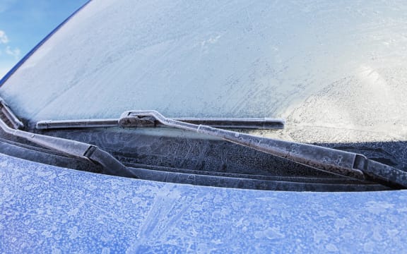 Frost covers a car's windshield on a cold winter morning (file photo)