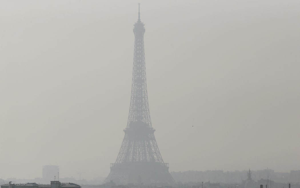 The Eiffel Tower seen through thick smog, on March 2014.