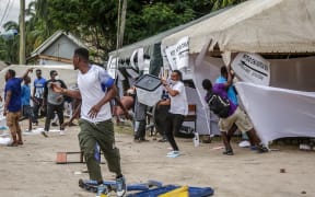 Protesters attack a polling station as clashes erupt in Dar es Salaam on 29 October, 2025, during Tanzania’s presidential elections.