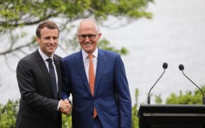 France's President Emmanuel Macron shakes hands with Australia's Prime Minister Malcolm Turnbull during a joint press conference in Sydney on 2 May, 2018.