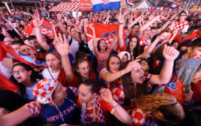 Croatia's supporters react as they watch on a giant screen the Russia 2018 World Cup semi-final football match between Croatia and England, at the main square in Zagreb on July 11, 2018.