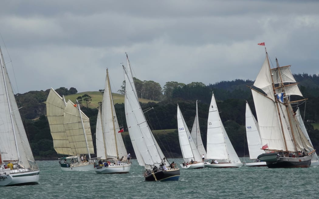 The waters off Russell are crowded with sails as the race gets underway.