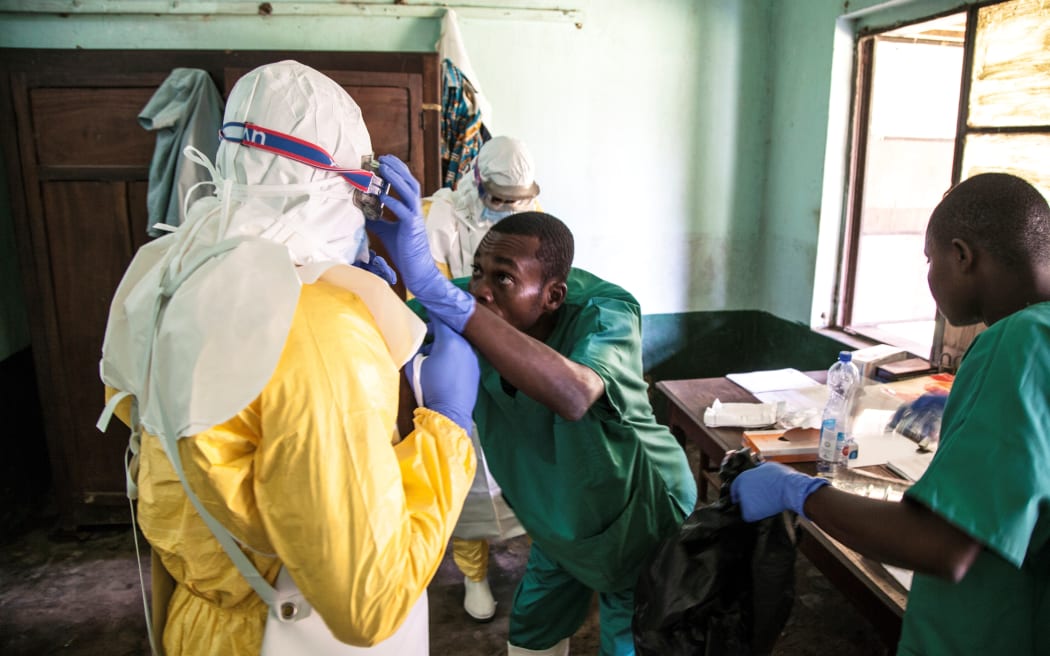 Health workers prepare to attend to suspected ebola patients at Bikoro Hospital in Democratic Republic of Congo on May 12, 2018, which has sealed off a ward to diagnose suspected Ebola patients and provide treatment.