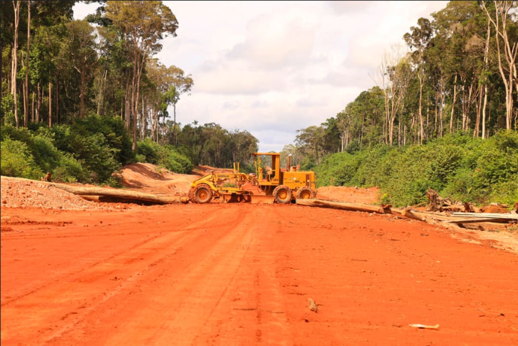 Heavy machinery and logs block access to Korindo's PT Inocin Abadi logging concession.