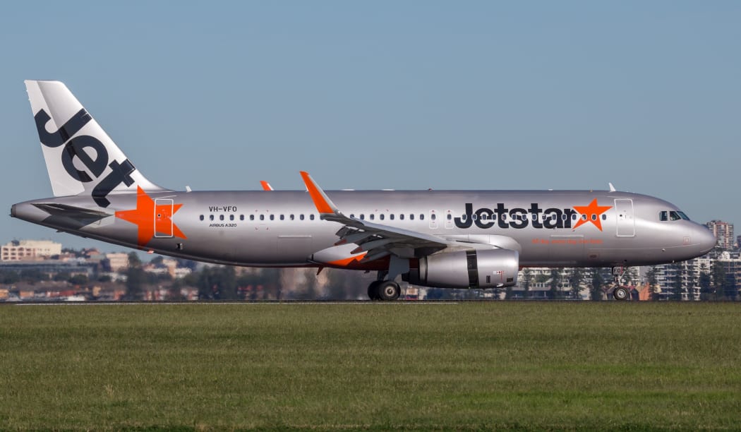 Sydney, Australia - May 5, 2014: Jetstar Airways Airbus A320 airliner landing at Sydney Airport.