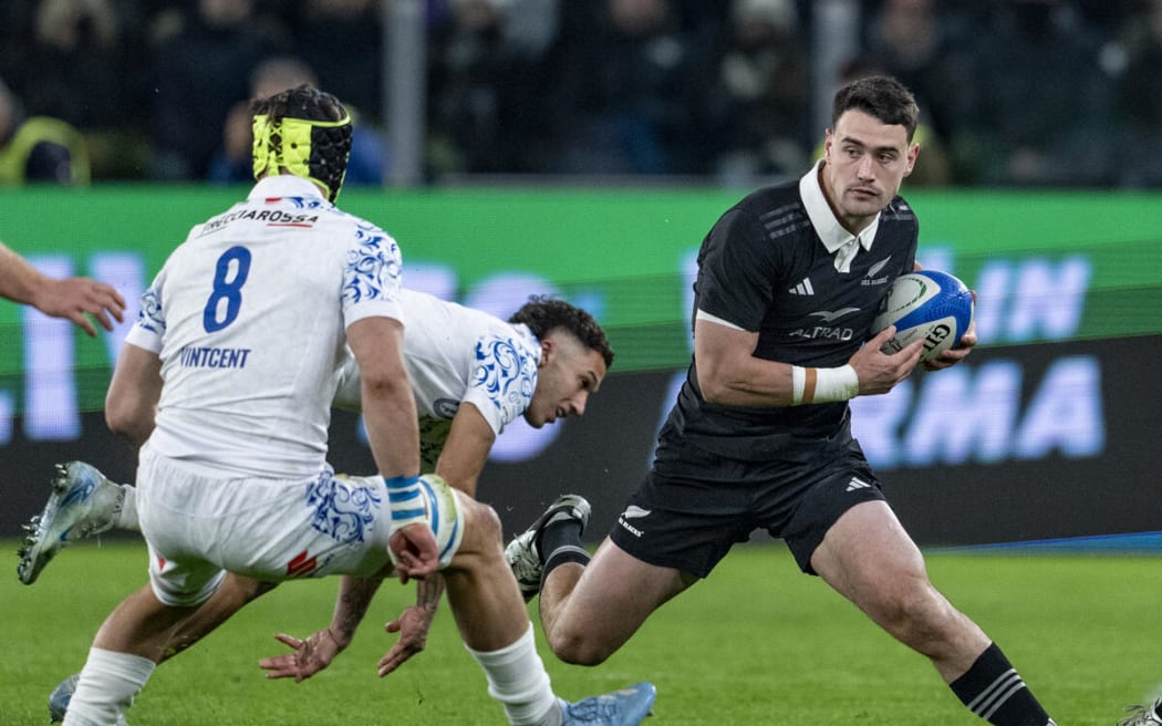 All Black Will Jordan attempts to evade Ross Vintcent of Italy during All Blacks v Italy.