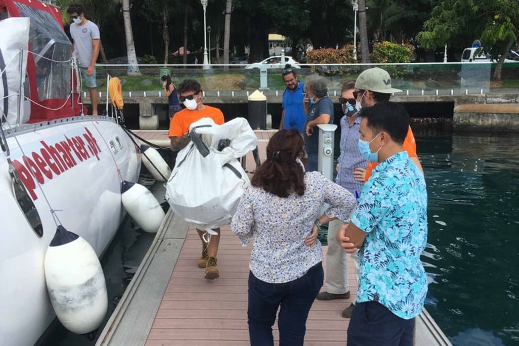 Pollution containment equipment readied  in Tahiti for use at Arutua where a Chinese ship with 250t of fuel is stuck