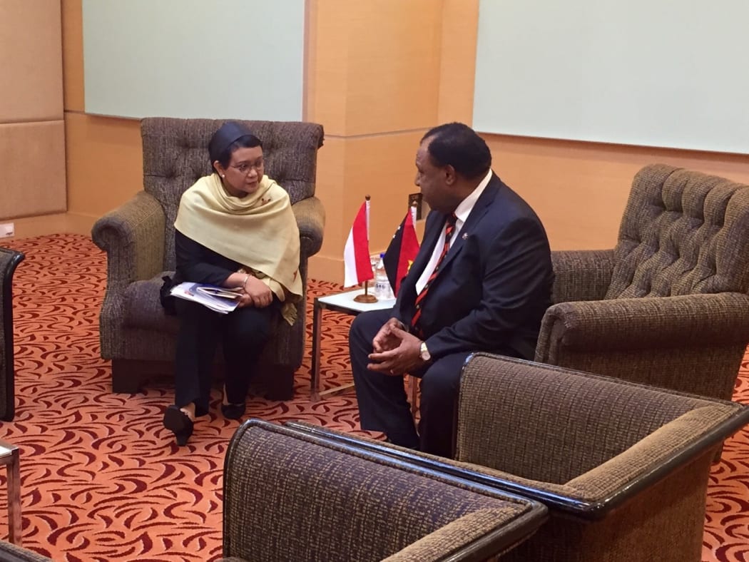 PNG Foreign Minister Rimbink Pato (right) talking to his Indonesian counterpart Retno Marsudi.