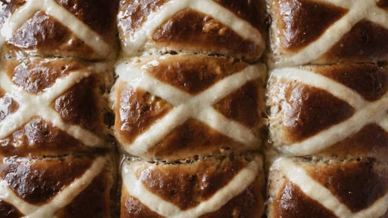 A section of fresh made hot cross buns.