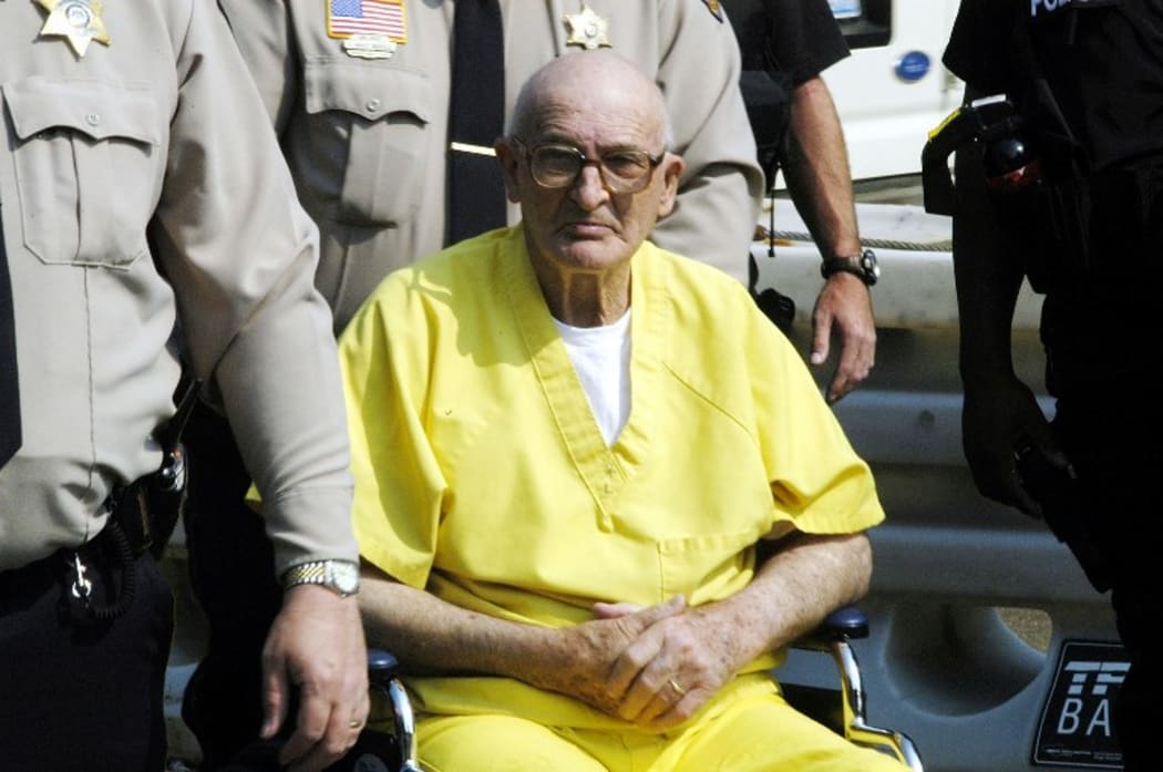 Edgar Ray Killen is escorted int o the Neshoba County Courthouse before sentencing 23 June 2005 in Philadelphia, Mississippi.