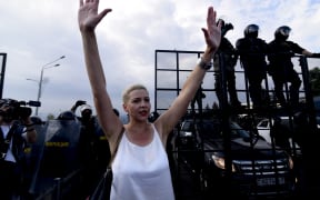 Belarusian musician and political activist Maria Kolesnikova is seen in front of the security forces standing guard to block protestors from reaching the Presidential Palace as people continue to protest over the presidential election in the capital Minsk, Belarus on August 30, 2020.