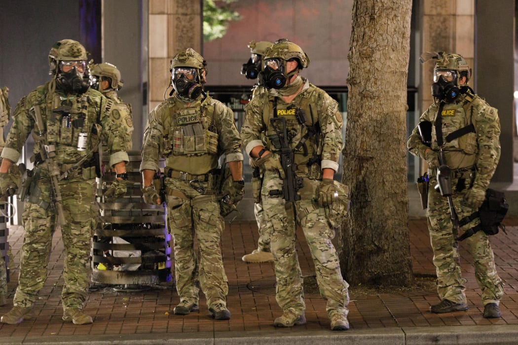 PORTLAND, OREGON, USA: Police confront demonstrators at Portland's Justice Centre.