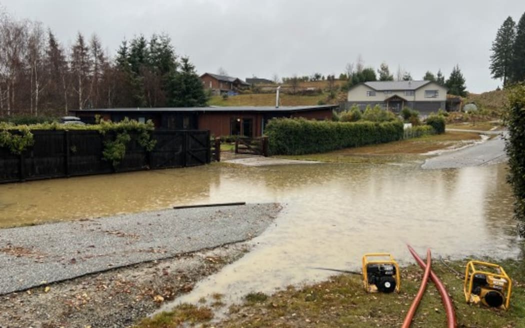 Water being pumped from Mount Roy Terrace, off Aubrey Road in Wānaka, at approximately 2pm on Monday, 1 July, 2024.
