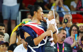 Dame Valerie Adams of New Zealand celebrates with her baby daughter Kimoana Josephine Adams Price