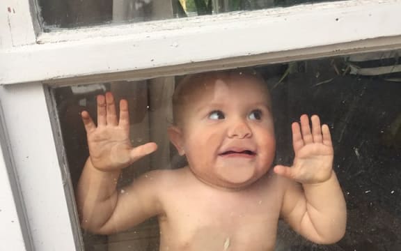 A portrait of Freddie, Bruce's youngest moko, visiting him at home as he recovers.