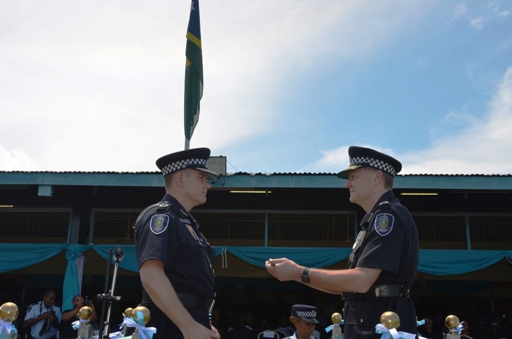 The new Solomon Islands police commissioner Matthew Varley farewells outgoing commissioner Frank Prendergast.