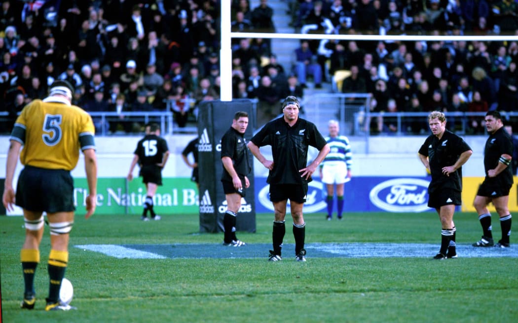 John Eales lines up to kick a penalty as Todd Blackadder watches on.