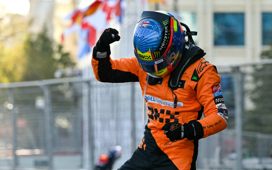 McLaren's Australian driver Oscar Piastri celebrates after winning the Formula One Azerbaijan Grand Prix at the Baku City Circuit, 2024.