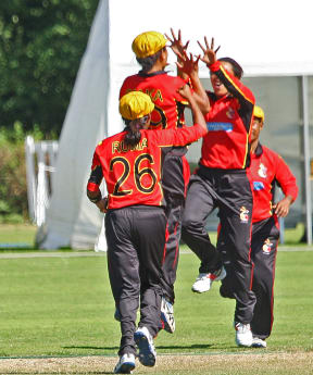 PNG celebrate a wicket against UAE at the World T20 Qualifiers.