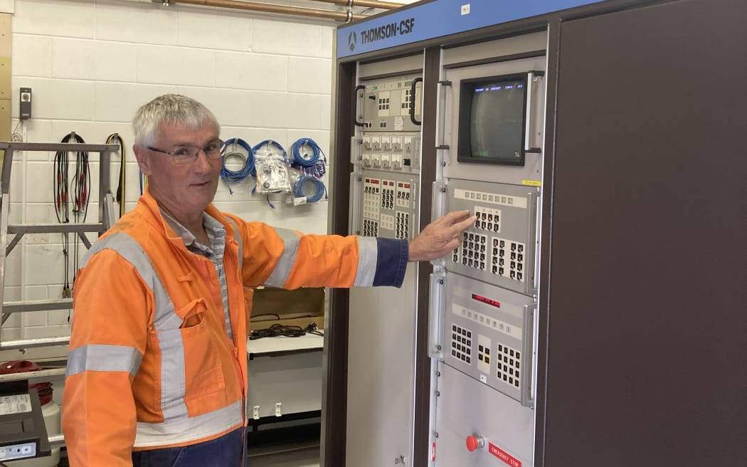 RNZ's Transmission Engineer Specialist, Stephen White, standing next to RNZ's transmitter 1.  Mr White is leading the project to decommission transmitter 1. Work to install the new transmitter will start in January 2024