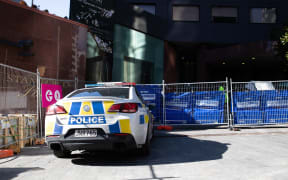A police car outside Stamford Plaza, which is being used as a managed isolation facility, in Auckland's CBD.